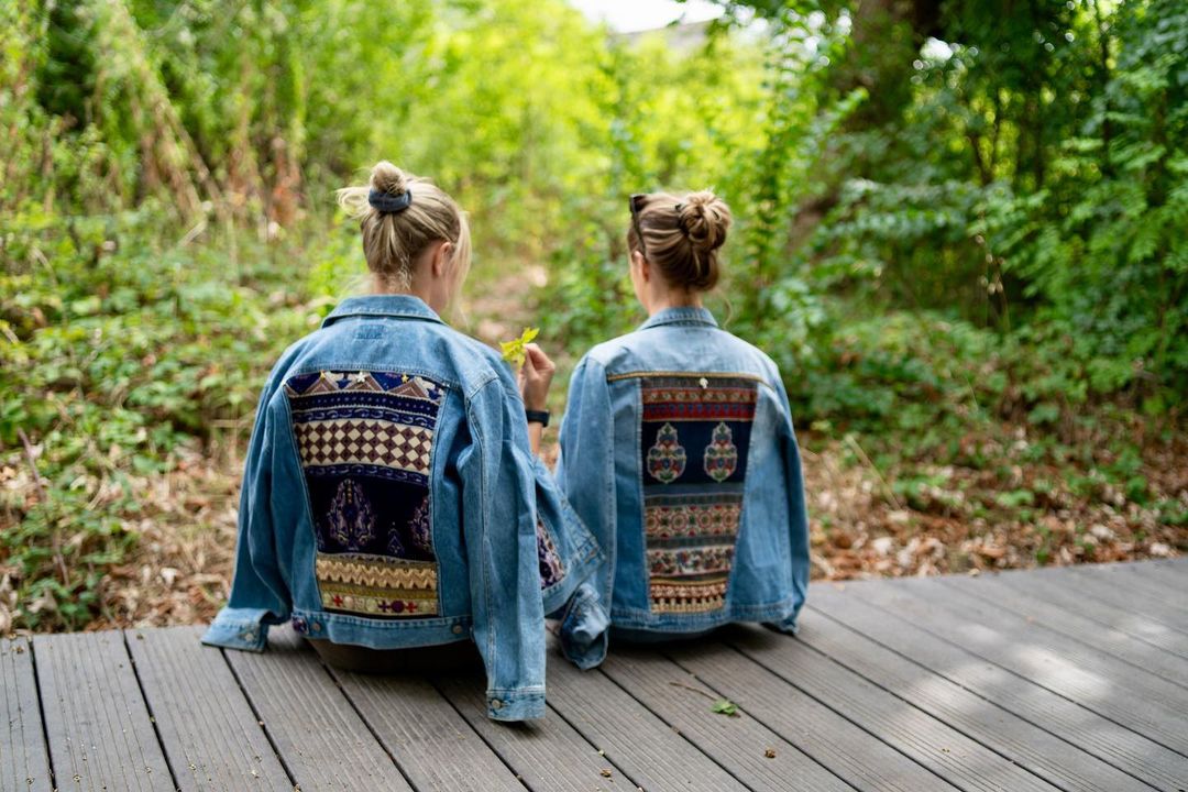 Two women modelling mpira jackets.